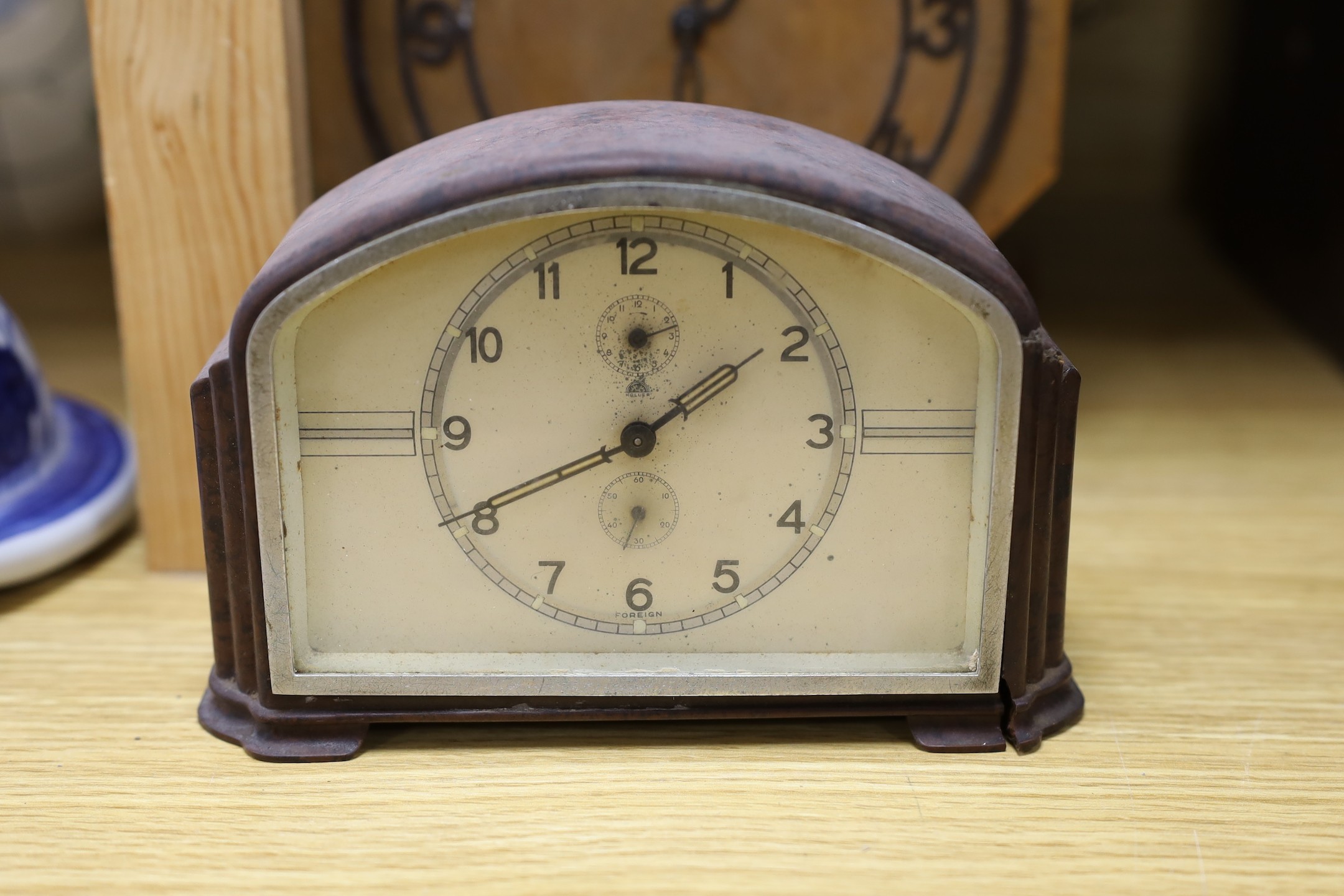 A Black Forest cuckoo clock, together with another octagonal faced timepiece, a Bakelite timepiece and another (4)